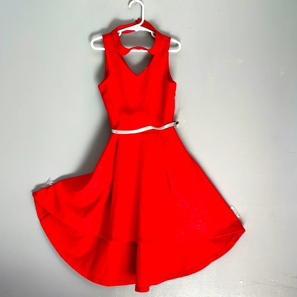 Beautiful girls size 7 dress. It is red with silver. New with no tags.